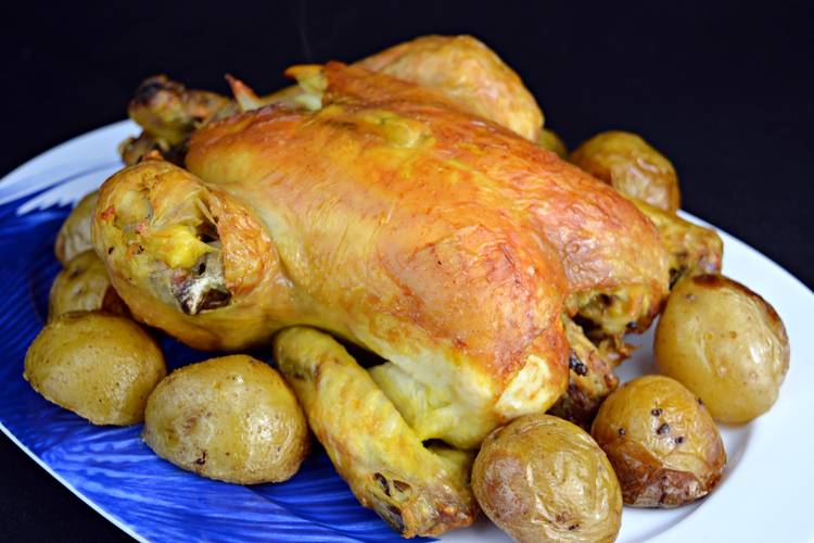 Receta de pollo al horno con limon y patatas asadas